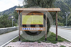 Information and educational board on the crest of the mudflow protection dam in Medeo