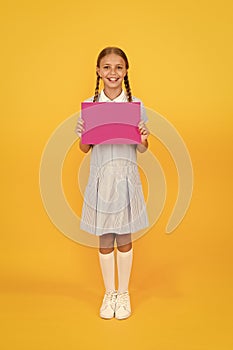 Information. girl hold blank pink paper. encyclopedia book for children. small girl love literature. old school. copy