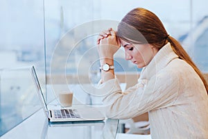 Information overload, stress concept, sad desperate woman with computer