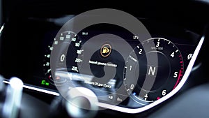 Information panel on a car - close up empty petrol, gasoline gauge dash board in car with digital warning sign of run