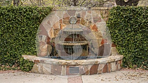 Information plaque for a fountain in an area in Oak Lawn Park by Arlington Hall in Dallas, Texas.