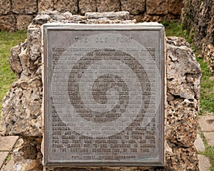 Information plaque at the seaward corner of the Old Fort remains in Lahaina Banyan Court Park on the island of Maui, Hawaii.