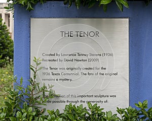 Information plaque for `Tenor`, a bronze silver sculpture at the head of the Esplanade at Fair Park in Dallas, Texas.