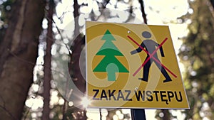 Information plate with a sign prohibiting entry into the forest.