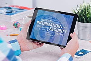 Information security concept on digital tablet pc in male hands