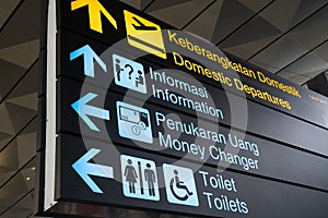 Information sign in English and Indonesian languages inside newly build Terminal 3 building of Soekarnoâ€“Hatta International