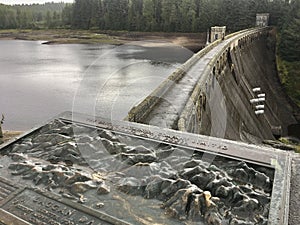 An information tile and Laggan Dam structure at Loch Laggan and River Spean in Scotland photo