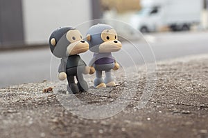 infrared image of the monkey toys on the asphalt street.