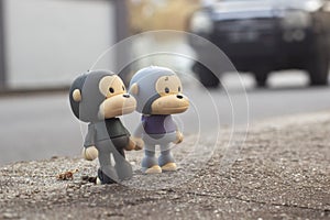 infrared image of the monkey toys on the asphalt street.