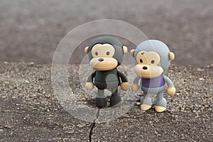 infrared image of the monkey toys on the asphalt street.