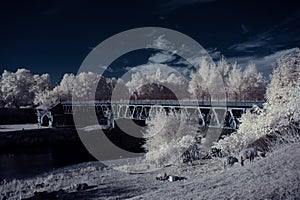 Infrared photography - ir photo of landscape with tree under sky with clouds - the art of our world and plants in the infrared cam