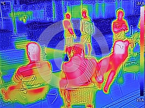 Infrared thermovision image showing when People sit at the table