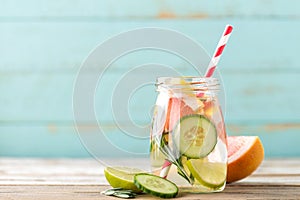 Infused detox water with lime, grapefruit, cucumber and rosemary photo