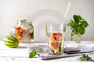 Infused water with strawberry and meloncella that is hybrid of cucumber and melon, thyme, mint.