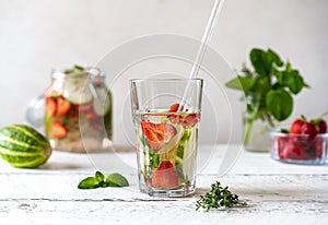 Infused water with strawberry and meloncella that is hybrid of cucumber and melon, thyme, mint.