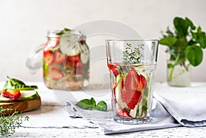 Infused water with strawberry and meloncella that is hybrid of cucumber and melon, thyme, mint.