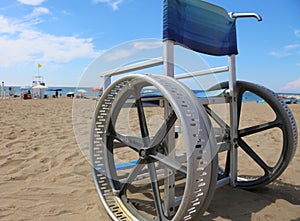 ingenious wheelchair with modified wheels to move even on the sa photo