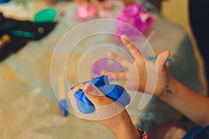 Ingredient for make home made Toy Called Slime, Teenager having fun and being creative homemade slime. Selective focus