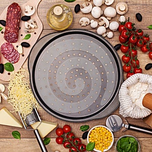 Ingredients around a pan ready to make a fresh homemade pizza