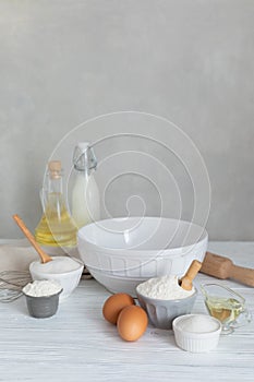 Ingredients for bakery butter flour, milk, oil, eggs, sugar, kitchen accessories