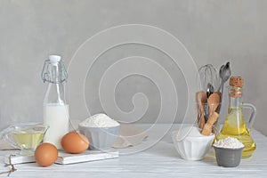 Ingredients for bakery butter flour, milk, oil, eggs, sugar, kitchen accessories