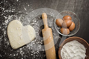 Ingredients bakery making on black wooden table