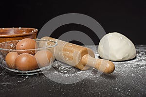 Ingredients bakery making on black wooden table