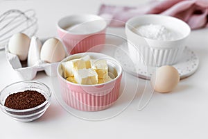 Ingredients for baking cake, cupcakes or brownies on kitchen table.