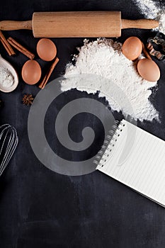 Ingredients for baking cookies on blackboard, top view