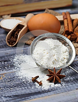 Ingredients for baking - egg, flour, sugar, cinnamon