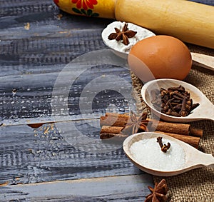 Ingredients for baking - egg, flour, sugar, cinnamon