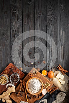 Ingredients for baking ginger cookies on a rustic wooden background