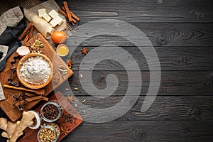 Ingredients for baking ginger cookies on a rustic wooden background