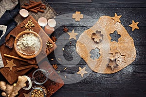 Ingredients for baking ginger cookies on a rustic wooden background