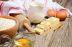 Ingredients for baking - milk, butter, eggs and flour.