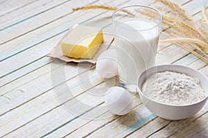 Ingredients for baking: milk, flour, egg and butter