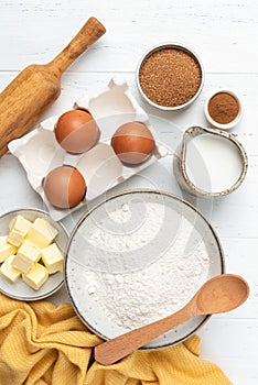 Ingredients for baking on white wooden table