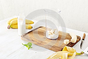 Ingredients for banana milkshake in home kitchen