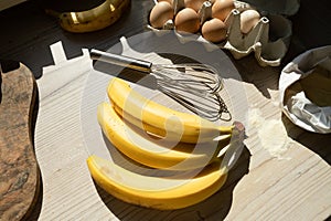 Ingredients for banana pastry, top view on the wooden table