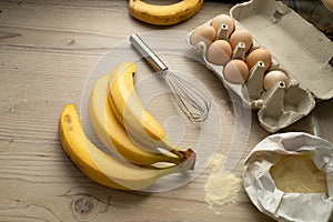 Ingredients for banana pastry, top view on the wooden table