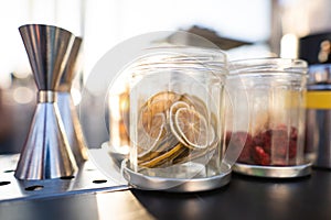 ingredients on the bartender's table for making alcoholic cocktails