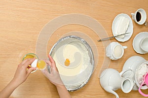 Ingredients for a cake on the wooden table