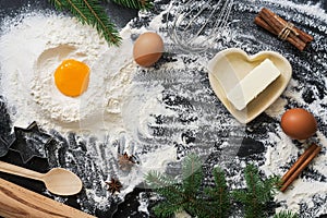Ingredients for Christmas baking on a dark background. Top view, copy space,flat lay