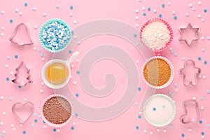 Ingredients and cookie cutter on pink background, flat lay