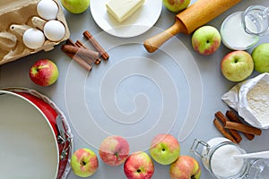 Ingredients for cooking apple pie. Fresh harvest apples, cinnamon, flour, sugar, butter, eggs, milk and baking mold