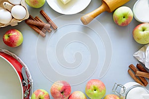 Ingredients for cooking apple pie. Fresh harvest apples, cinnamon, flour, sugar, butter, eggs, milk and baking mold