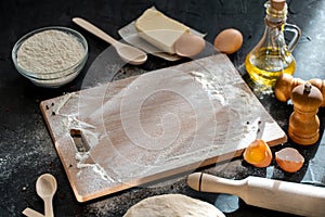 Ingredients for cooking baking - flour, eggs, and spices on on wooden table