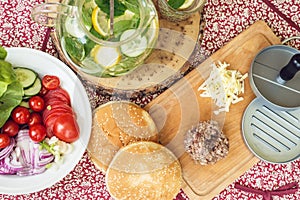 Ingredients for cooking burgers. Raw ground beef