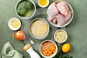 Ingredients for cooking chicken with orzo paste and vegetables.