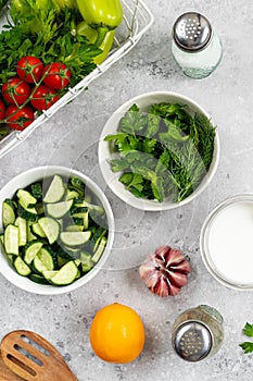 Ingredients for cooking Greek meatballs with salad and tzatziki sauce.